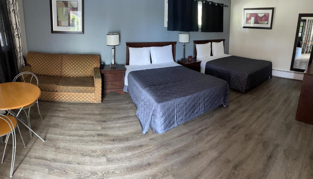 Postel nebo postele na pokoji v ubytování Nites Inn Motel