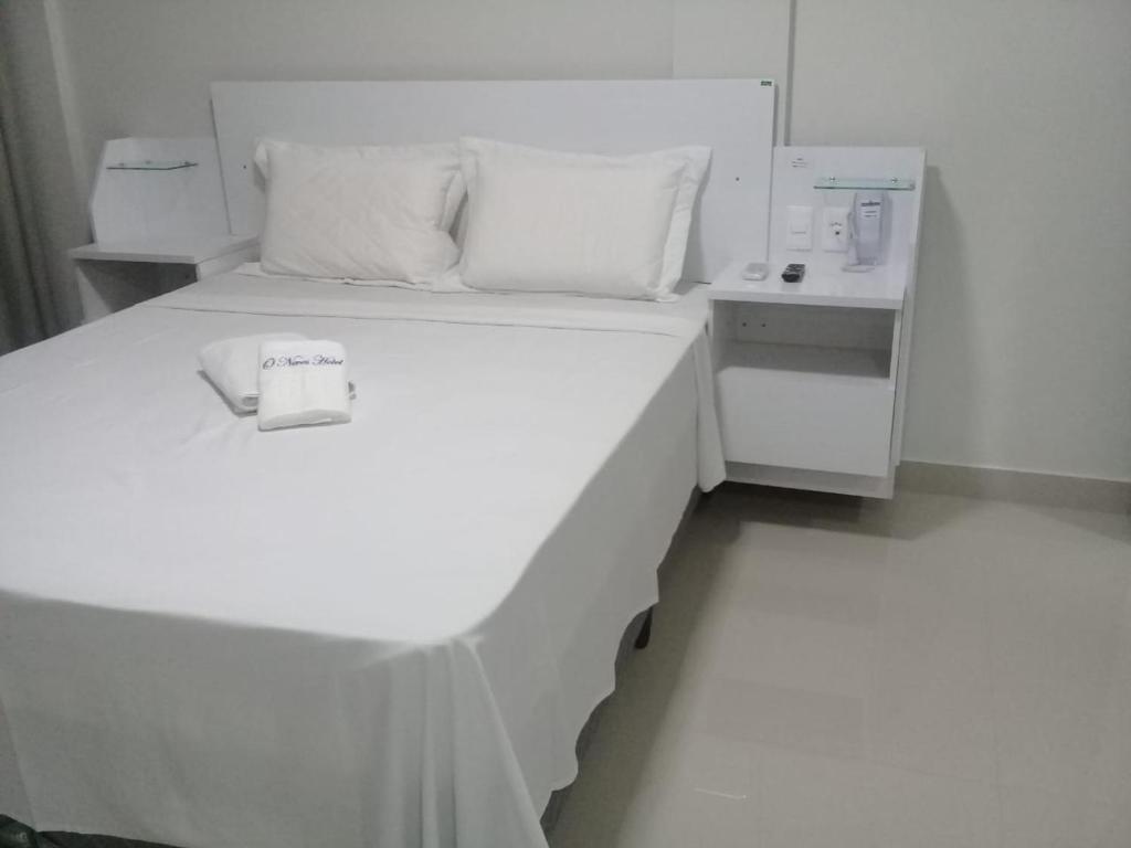 Postel nebo postele na pokoji v ubytování O Neves Hotel
