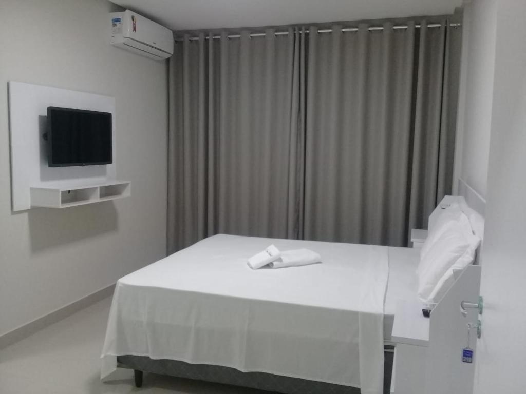 TV a/nebo společenská místnost v ubytování O Neves Hotel