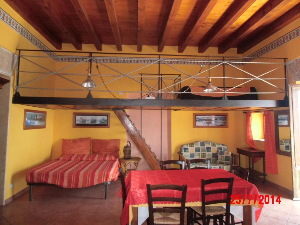 a living room with a couch and a table at Holiday home Santa Flavia in Santa Flavia