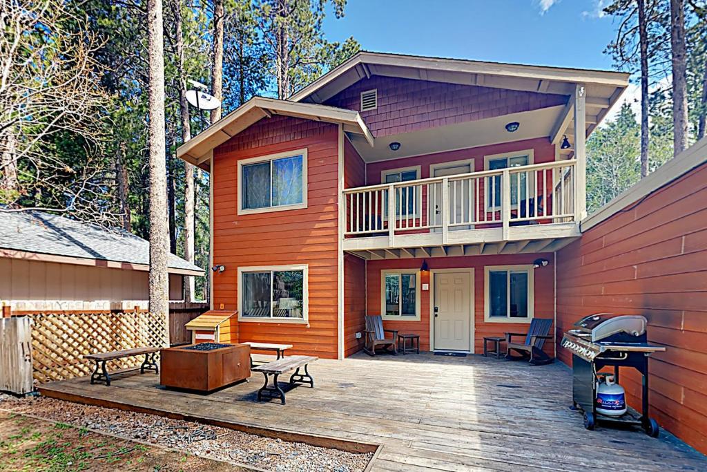 a large house with a deck and a balcony at Cellador Charms in South Lake Tahoe