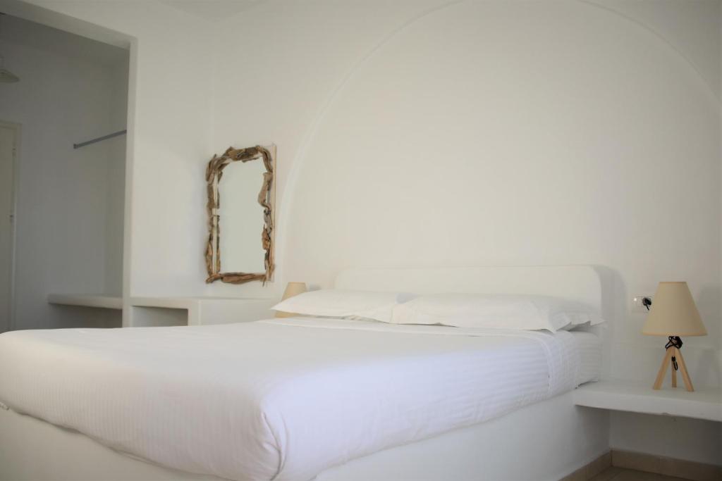 Postel nebo postele na pokoji v ubytování Harmony Hotel