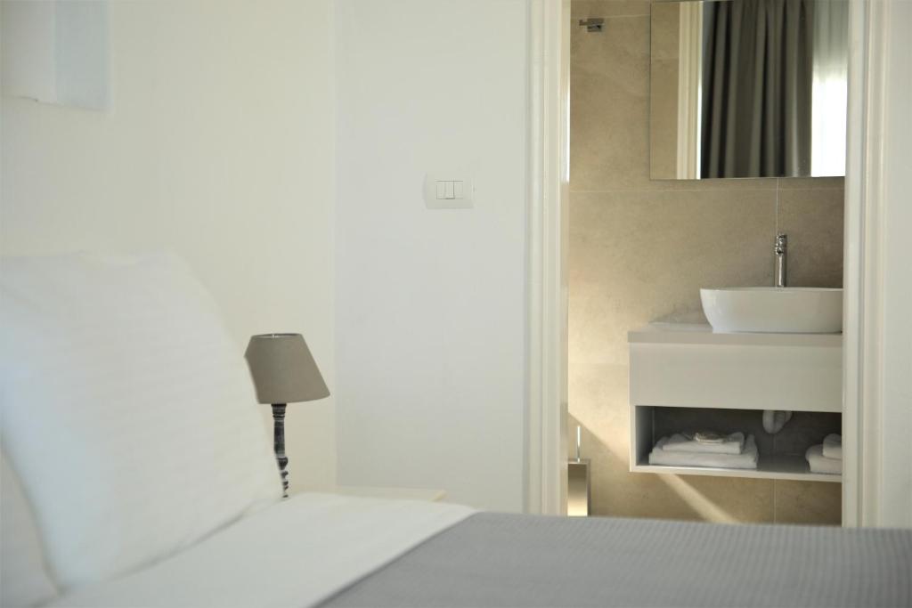 Postel nebo postele na pokoji v ubytování Harmony Hotel