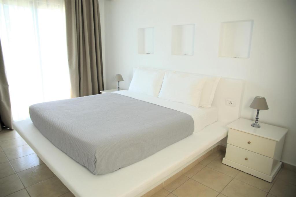 Postel nebo postele na pokoji v ubytování Harmony Hotel