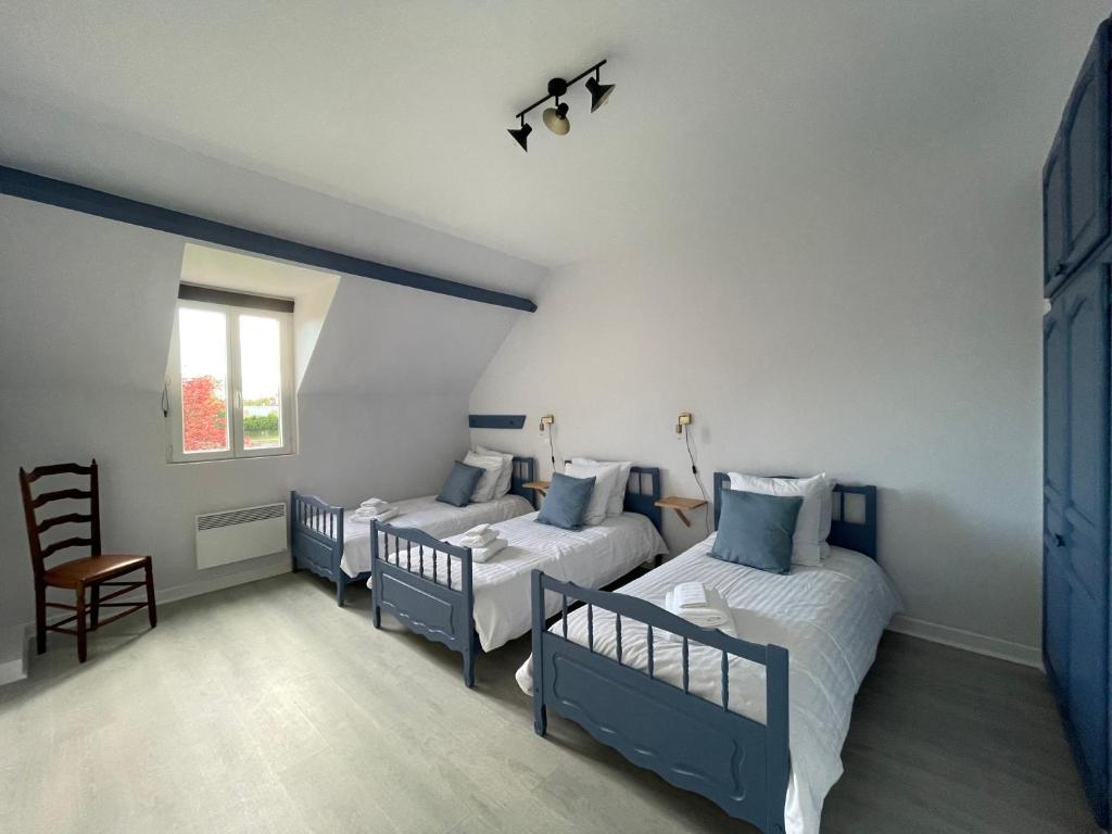 Posteľ alebo postele v izbe v ubytovaní Gîte Gold - La Ferme Delaunay
