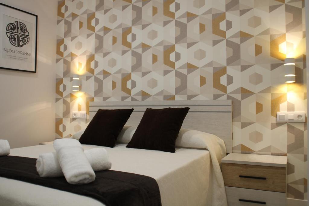 Rúm í herbergi á Baixo a Lua Rooming