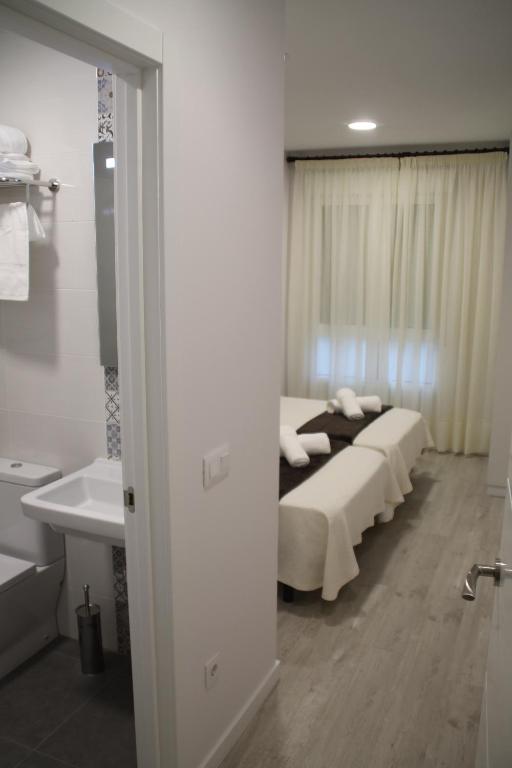 Rúm í herbergi á Baixo a Lua Rooming