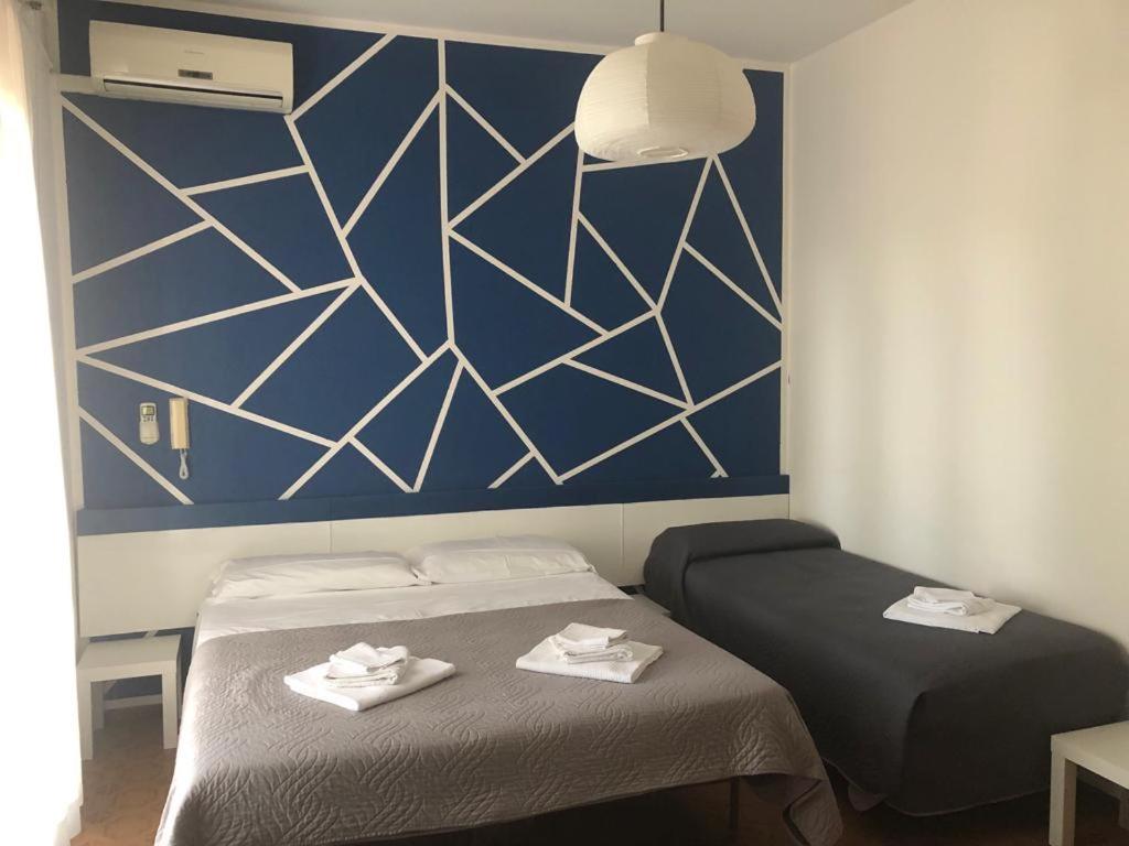 Postel nebo postele na pokoji v ubytování Alice Hotel
