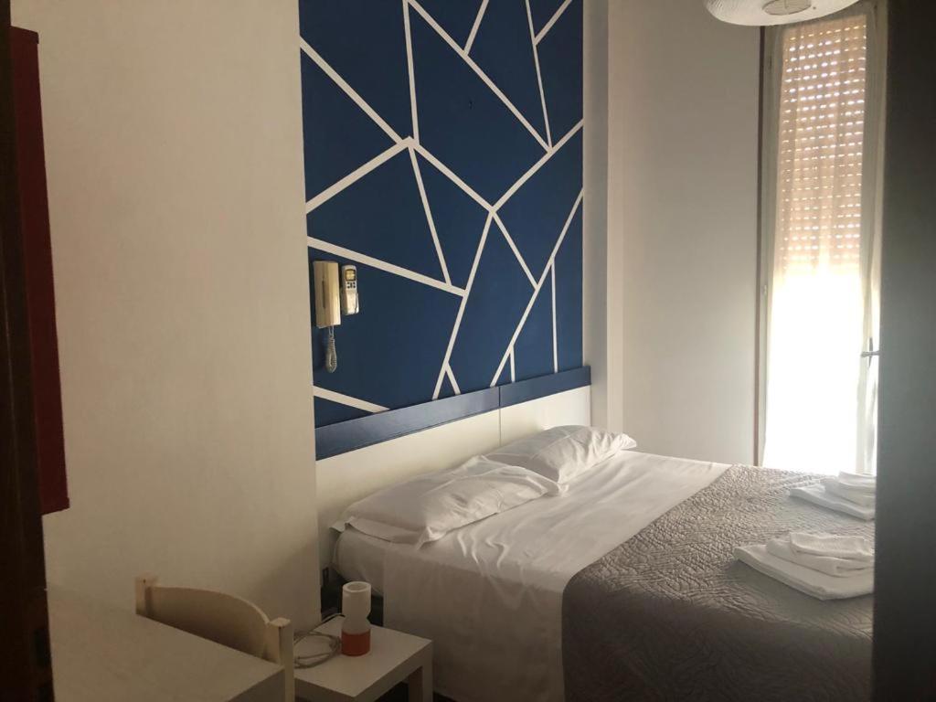 Postel nebo postele na pokoji v ubytování Alice Hotel
