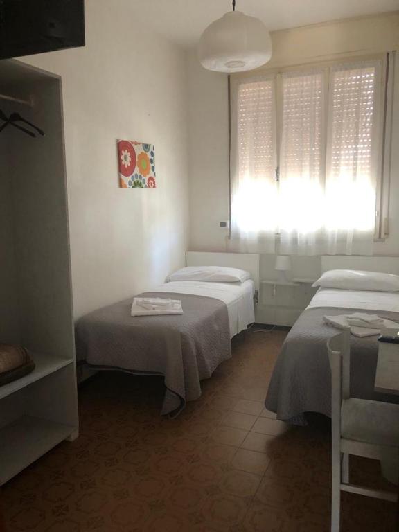 Postel nebo postele na pokoji v ubytování Alice Hotel