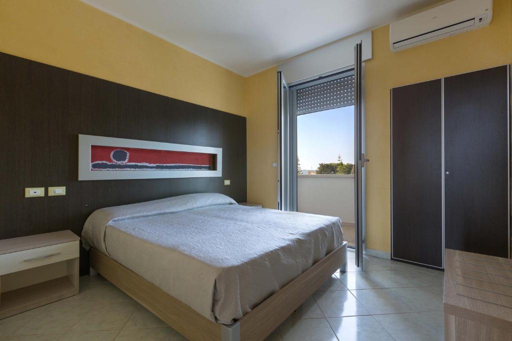 Postel nebo postele na pokoji v ubytování Residence Solaris