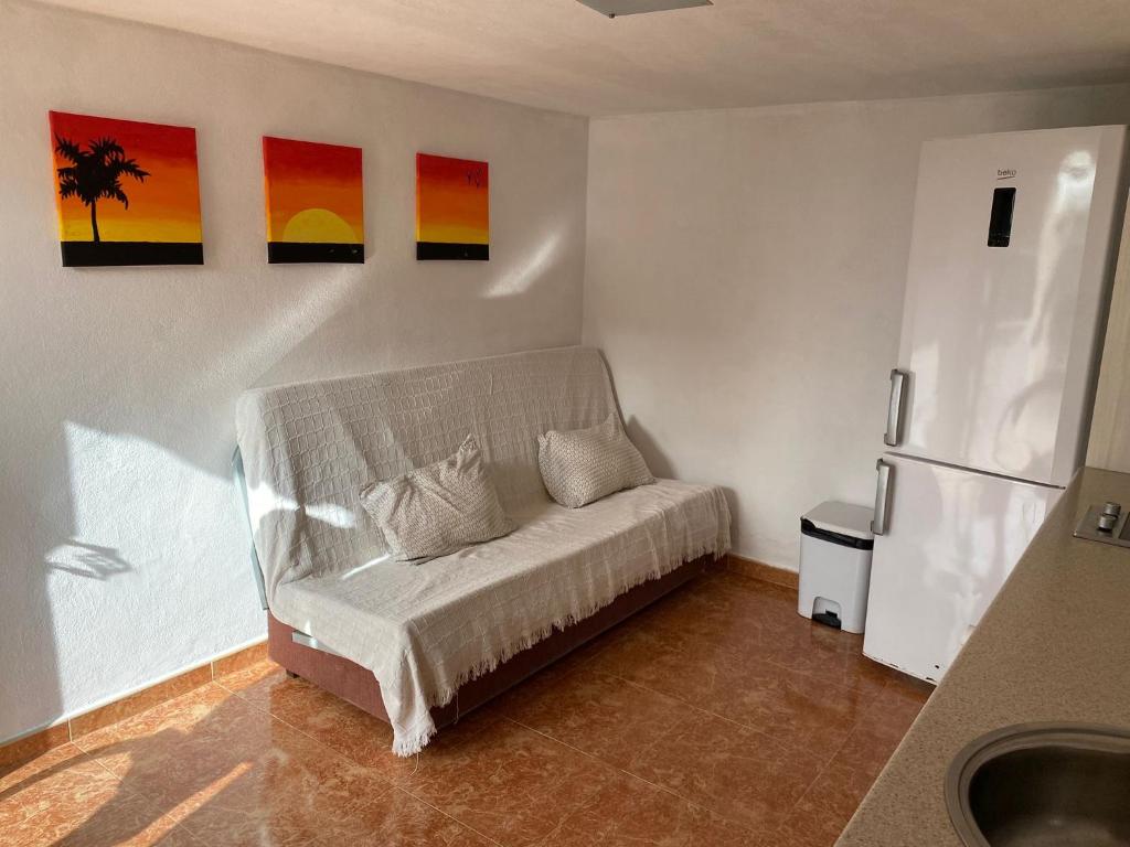 A bed or beds in a room at Apartamento Malaga Aeropuerto