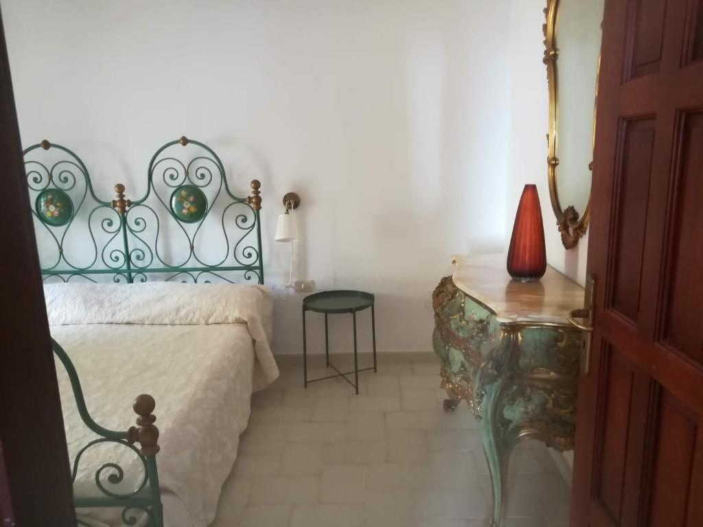 Ліжко або ліжка в номері Casa dello Ziro