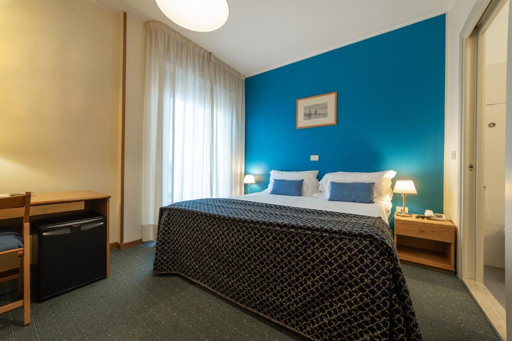 Postel nebo postele na pokoji v ubytování Hotel La Vela