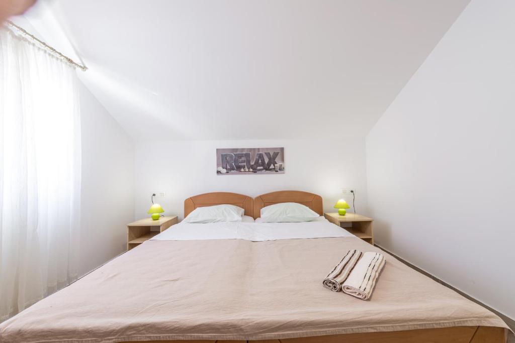 Posteľ alebo postele v izbe v ubytovaní Apartments Vukelic