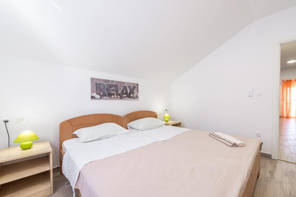 Posteľ alebo postele v izbe v ubytovaní Apartments Vukelic