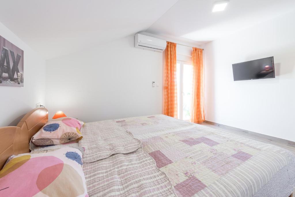 Posteľ alebo postele v izbe v ubytovaní Apartments Vukelic