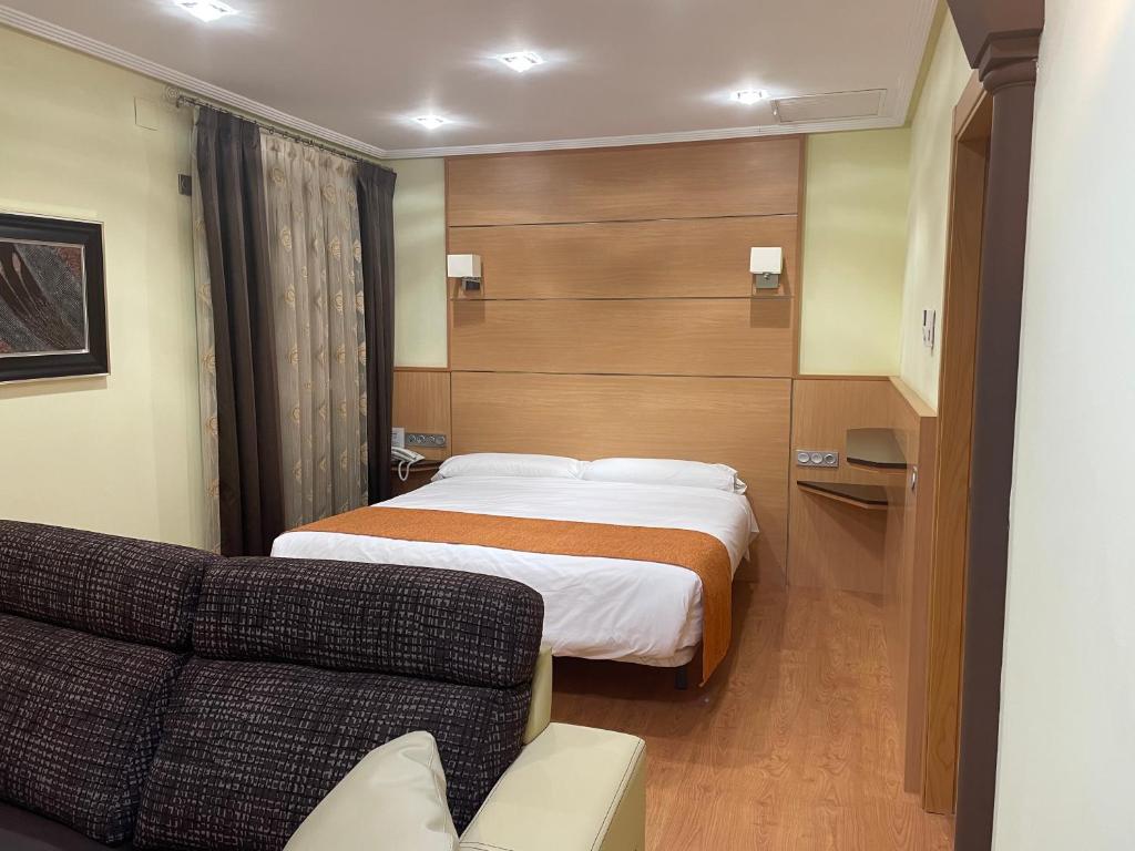 Postel nebo postele na pokoji v ubytování Hotel Malena