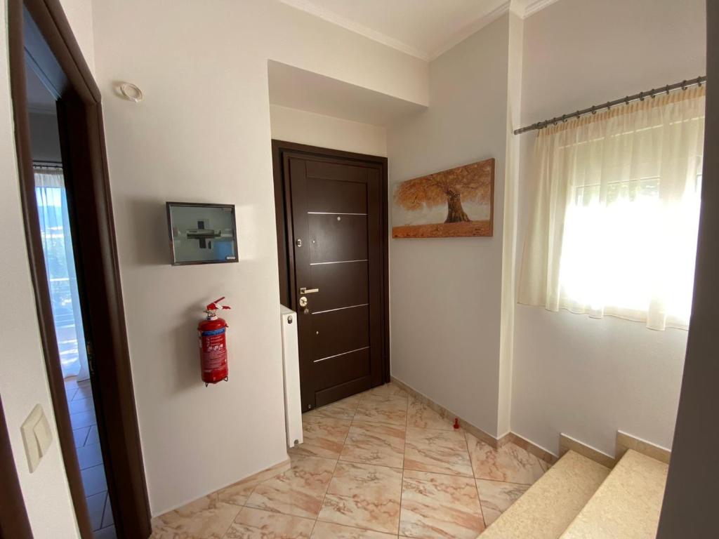 Telewizja i/lub zestaw kina domowego w obiekcie Oasis Villa - Maisonette A