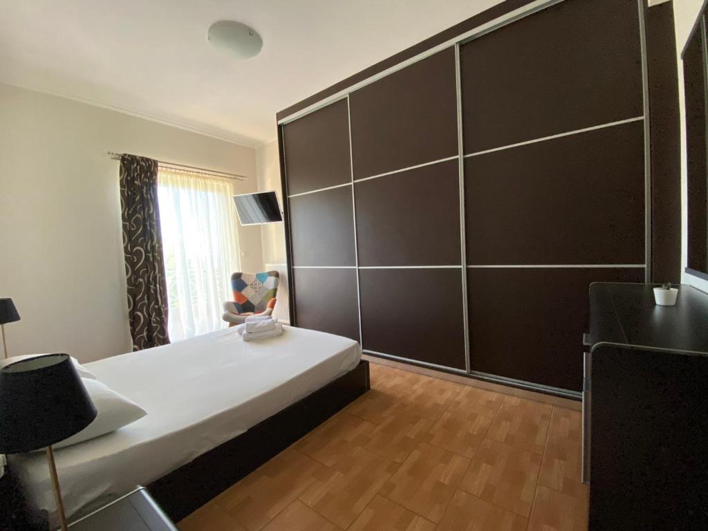 Łóżko lub łóżka w pokoju w obiekcie Oasis Villa - Maisonette A