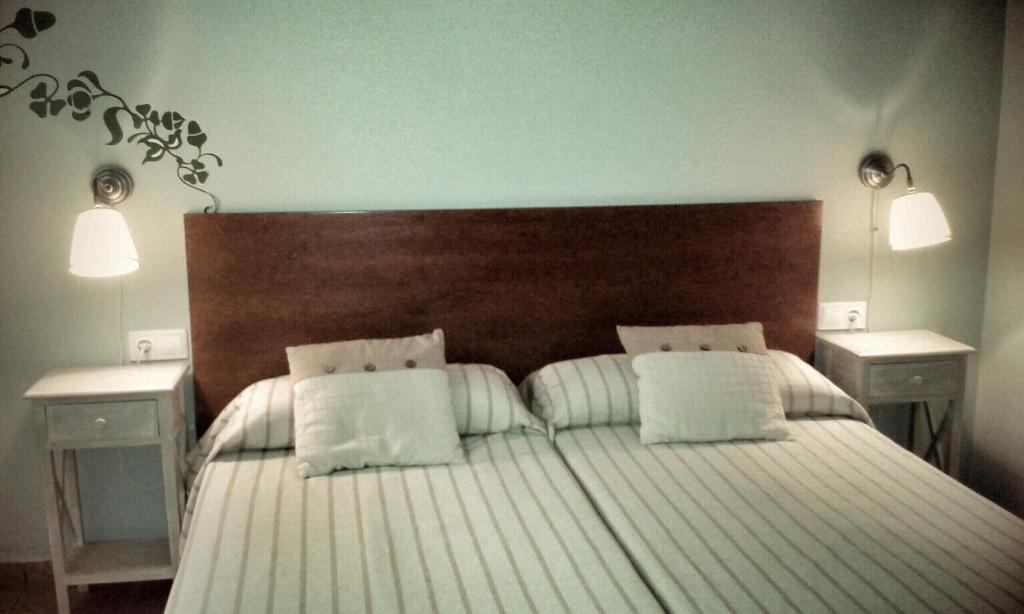 Postel nebo postele na pokoji v ubytování B&B Ra Tenaja
