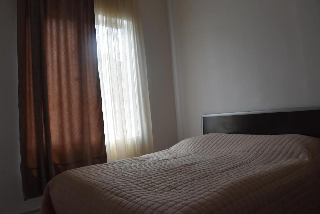 Postel nebo postele na pokoji v ubytování Guesthouse Natalia