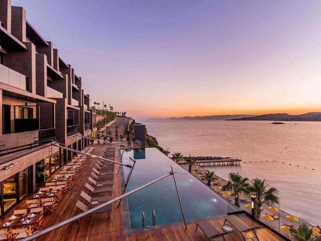 a view of the ocean from a hotel balcony at MGallery The Bodrum Hotel Yalikavak in Yalıkavak