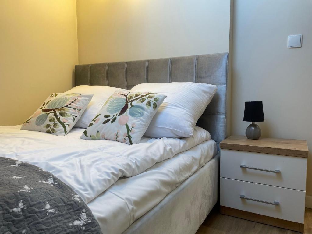 Posteľ alebo postele v izbe v ubytovaní Apartamenty & Spa Stara Polana