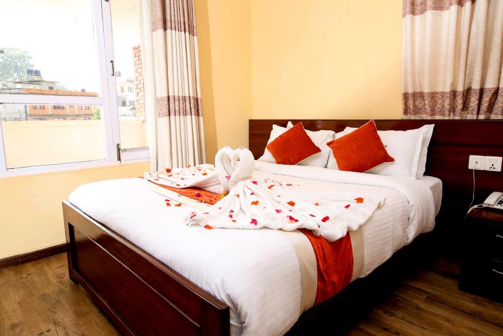 Postel nebo postele na pokoji v ubytování Sampada Garden Resort