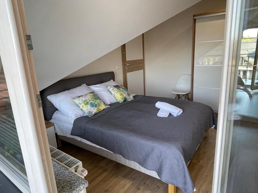 Posteľ alebo postele v izbe v ubytovaní Apartamenty & Spa Stara Polana