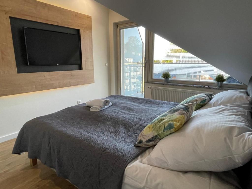 Posteľ alebo postele v izbe v ubytovaní Apartamenty & Spa Stara Polana