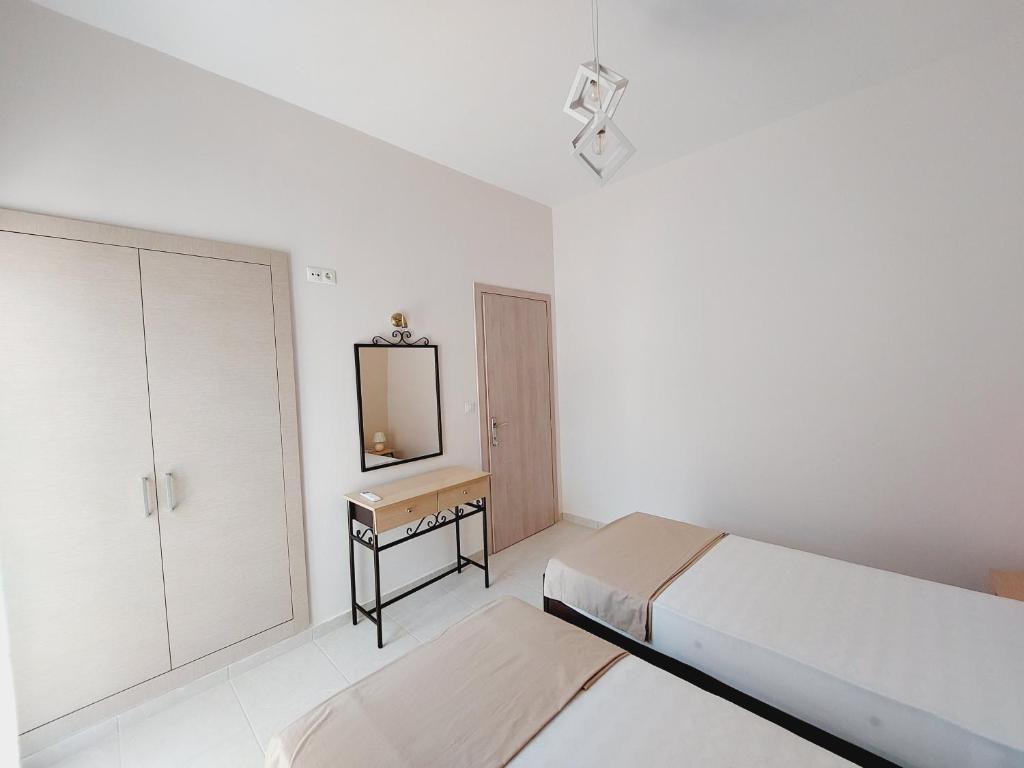 Postel nebo postele na pokoji v ubytování STAMATIS CORFU APARTMENTS