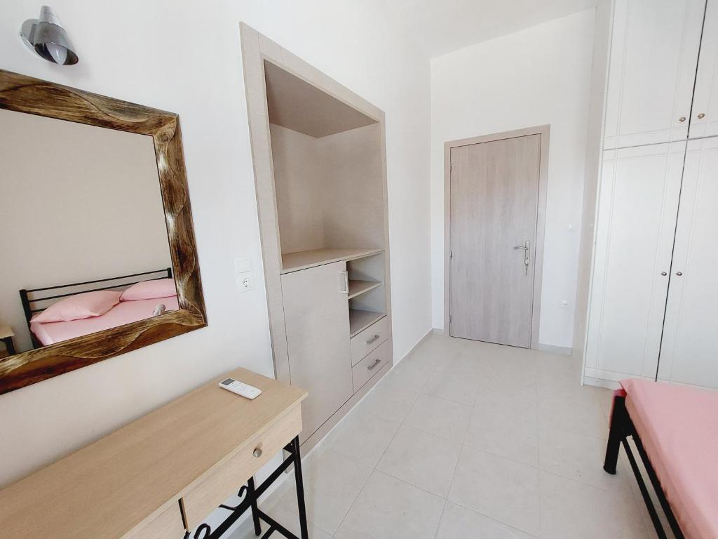 Postel nebo postele na pokoji v ubytování STAMATIS CORFU APARTMENTS