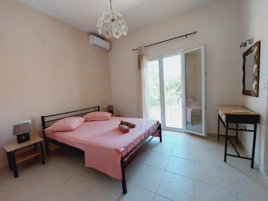 Postel nebo postele na pokoji v ubytování STAMATIS CORFU APARTMENTS