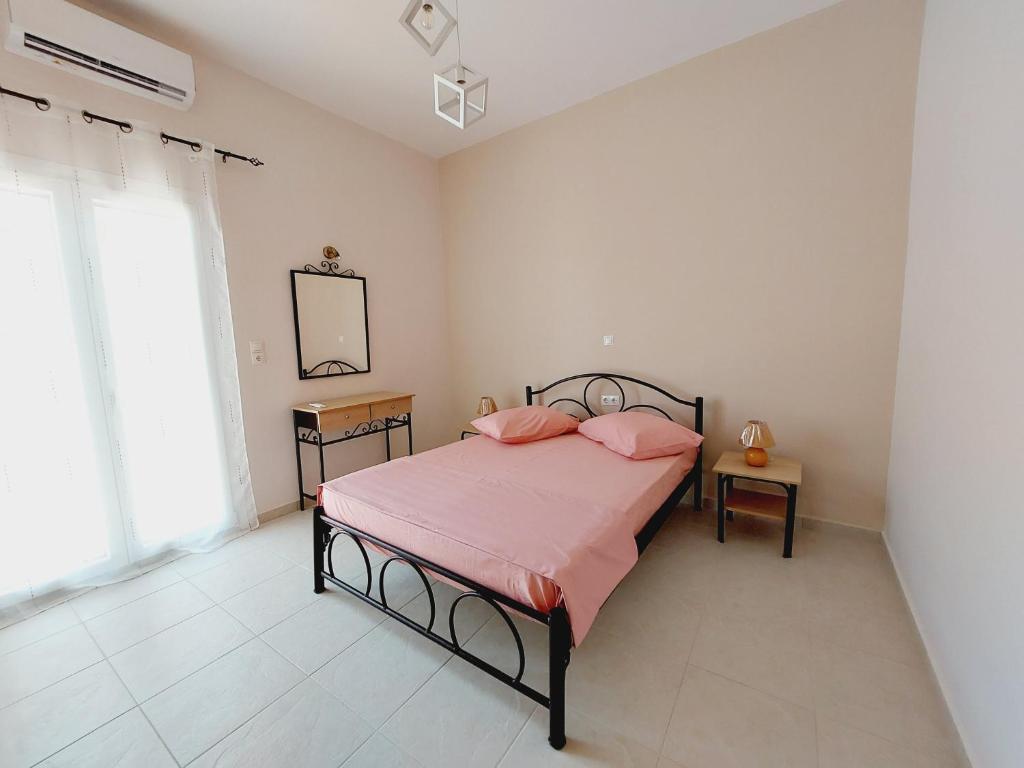 Postel nebo postele na pokoji v ubytování STAMATIS CORFU APARTMENTS