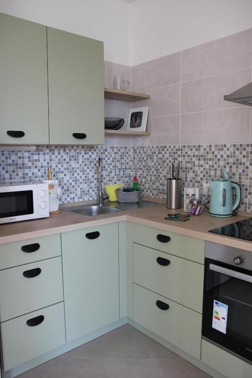 Kuchyňa alebo kuchynka v ubytovaní Apartment Kantrida