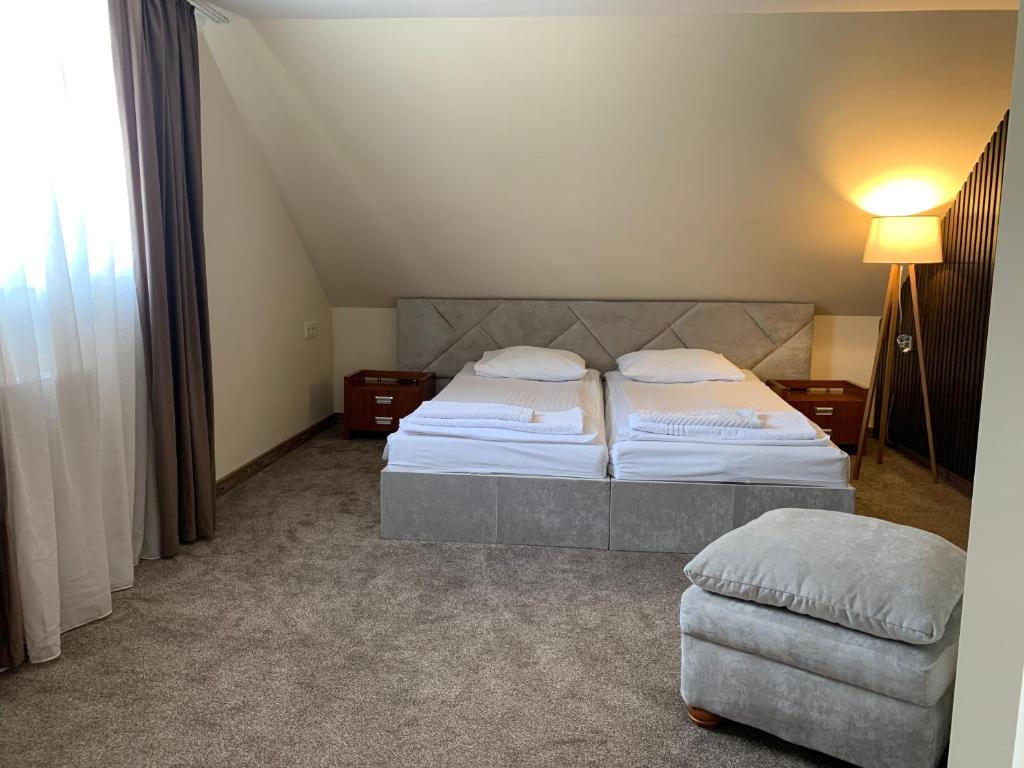 Postel nebo postele na pokoji v ubytování Eduard Hotel