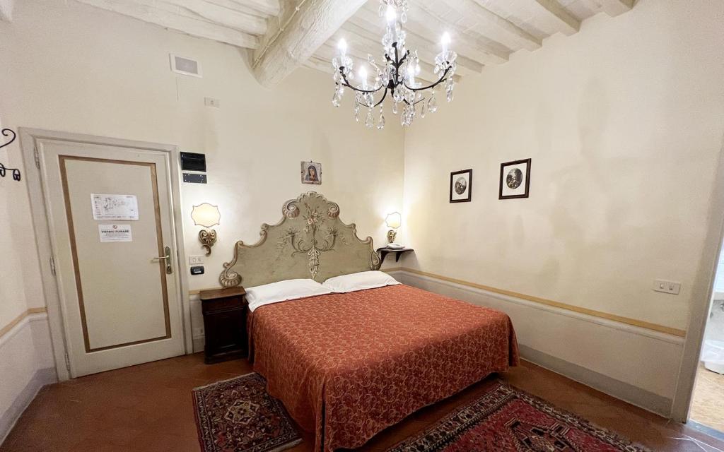 Postel nebo postele na pokoji v ubytování Hotel San Michele