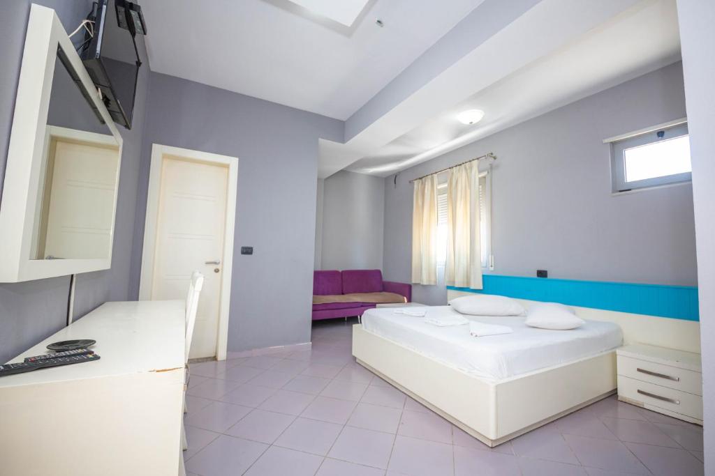 Postel nebo postele na pokoji v ubytování Hotel Tosi