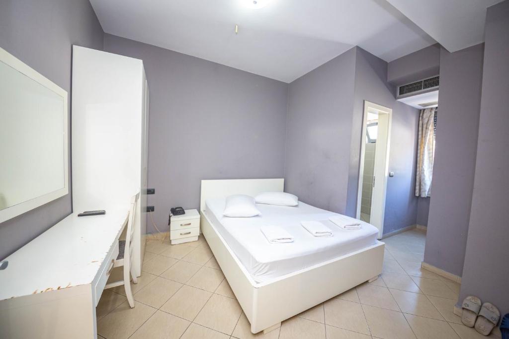 Postel nebo postele na pokoji v ubytování Hotel Tosi
