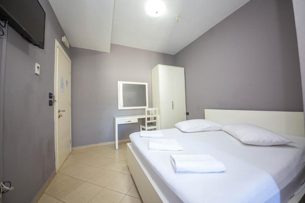 Postel nebo postele na pokoji v ubytování Hotel Tosi