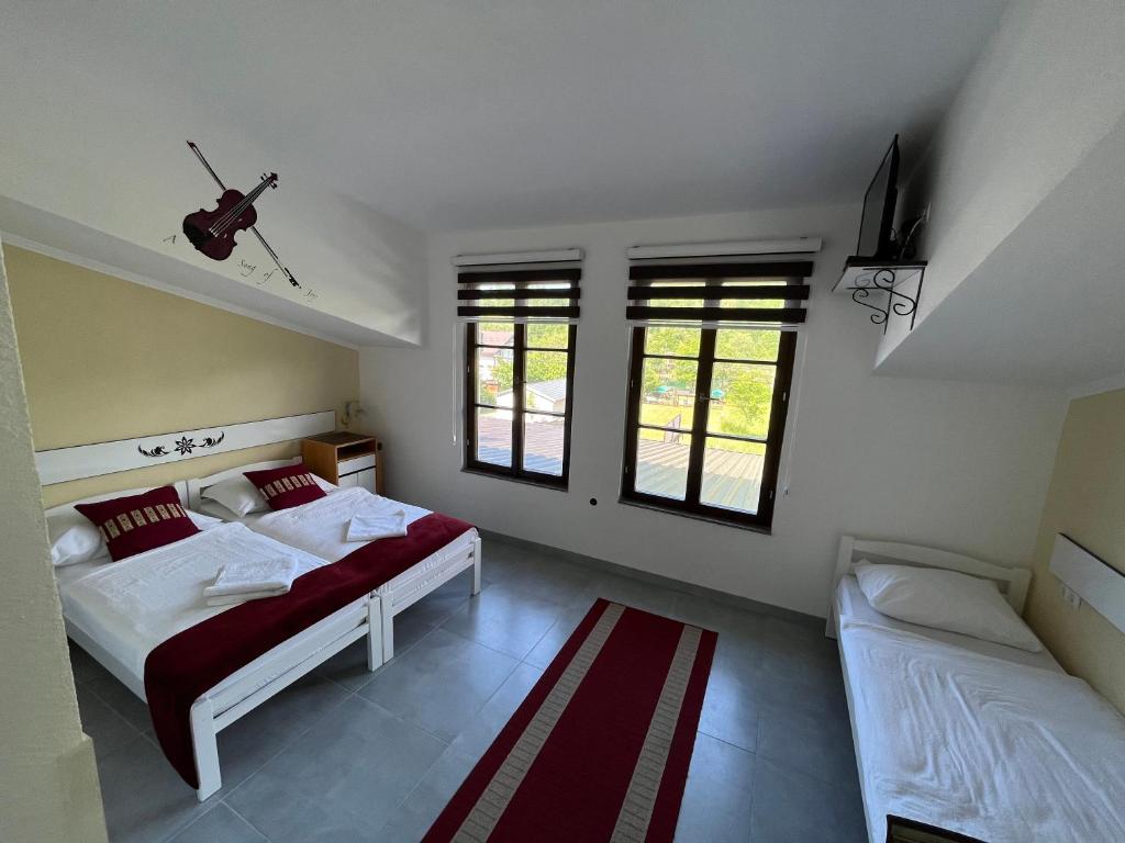 Postel nebo postele na pokoji v ubytování Rooms and Apartments Neron Bihać