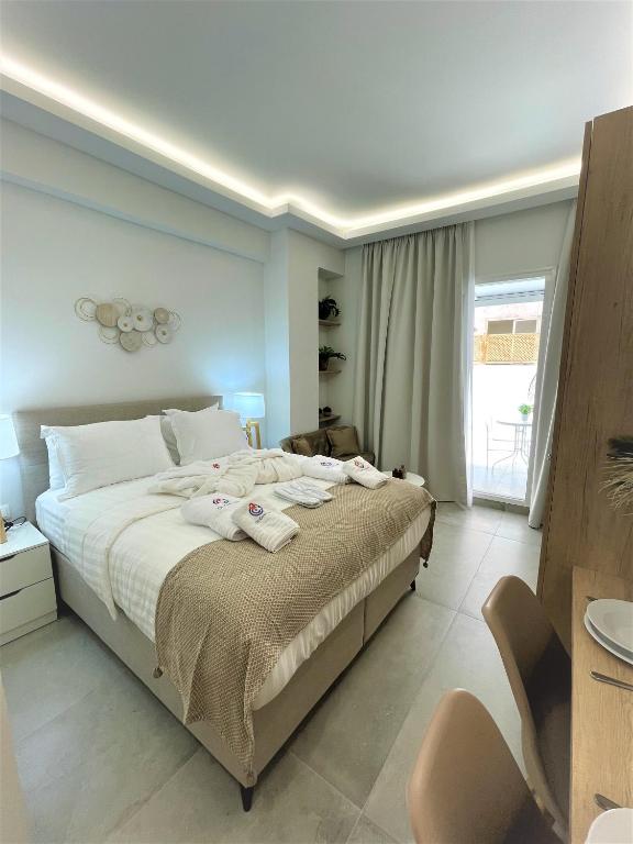 Posteľ alebo postele v izbe v ubytovaní Chic Centre Suites Athens