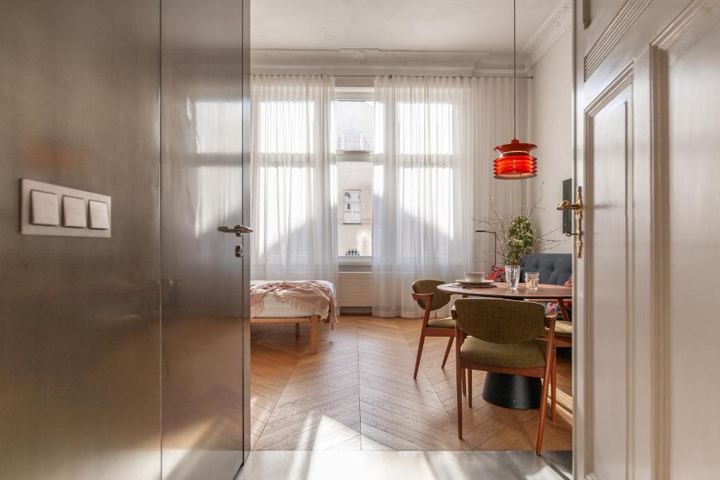 a room with a table and a dining room at Wyspa 12 in Poznań