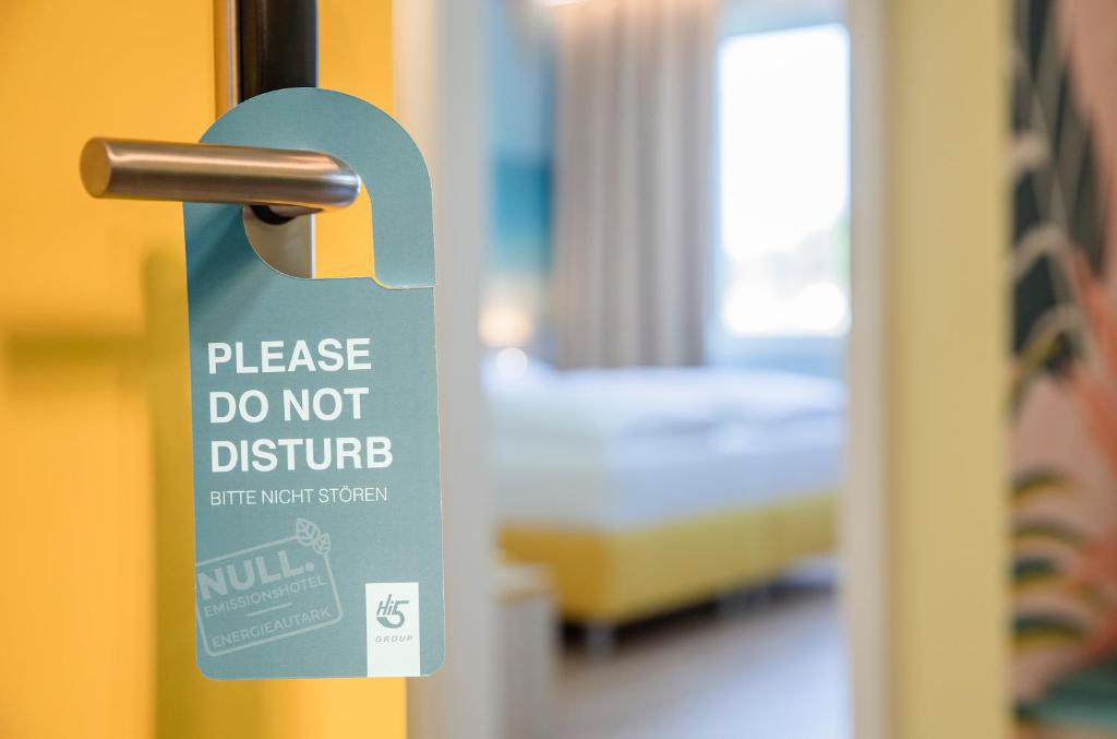 Letto o letti in una camera di Hi5-Hotel Seiersberg