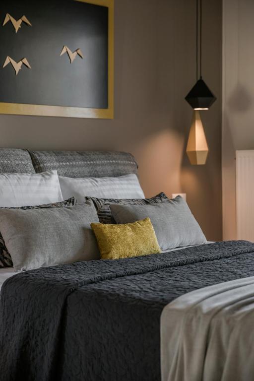 Postel nebo postele na pokoji v ubytování Olea O' Luxury Living