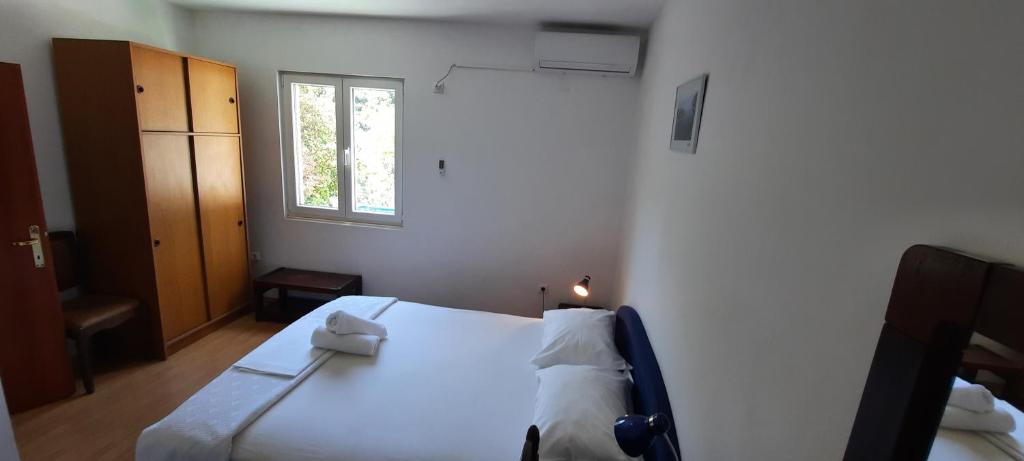 Łóżko lub łóżka w pokoju w obiekcie Apartments Lampalo