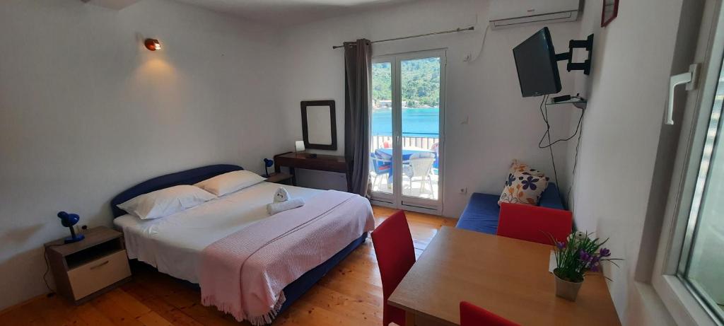 Łóżko lub łóżka w pokoju w obiekcie Apartments Lampalo