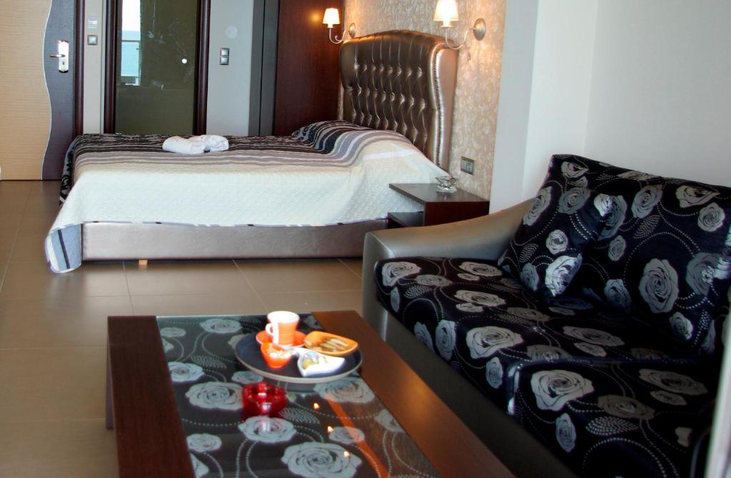 Postel nebo postele na pokoji v ubytování Dion Hotel