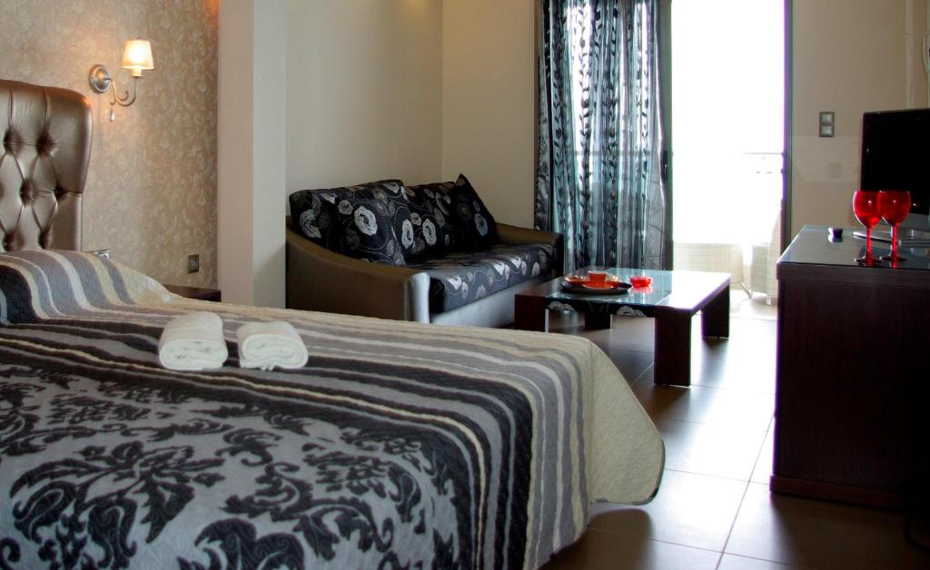 Postel nebo postele na pokoji v ubytování Dion Hotel